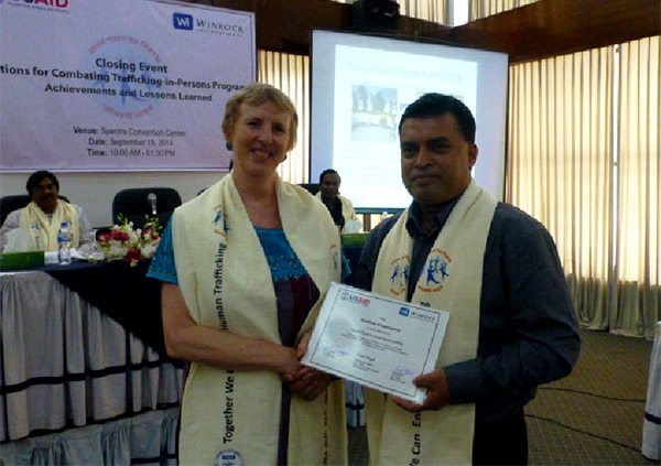 Md. Arifur Rahman receives Certificate of Appreciation from Ms. Sara Stephens of Winrock International