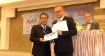 Mahabubur Rahamn receiving certificate from president of IOGT International.