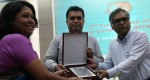 Md. Arifur Rahman, CE and Nasim Banu from YPSA receive a creast