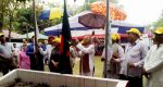 Dr. Qazi Kholiquzzaman Ahmad, President of Palli Karma-Sahayak Foundation (PKSF) inaugurating the convention raising the national flag