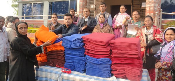 A beneficiary receives warm blanket from Md. Arifur Rahman