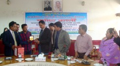 Successful migrant receiving crest from DC of Cox'sbazar