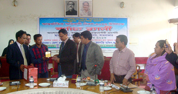 Successful migrant receiving crest from DC of Cox'sbazar