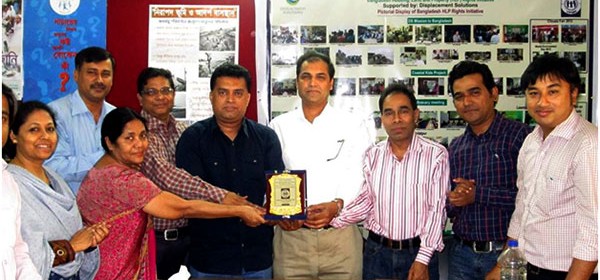 YPSA officials are handing over official crest (Memento) to Adv. Moktader Billah.