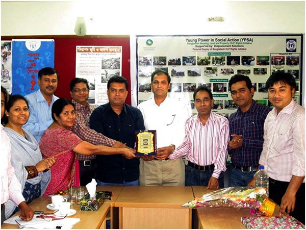 YPSA officials are handing over official crest (Memento) to Adv. Moktader Billah.