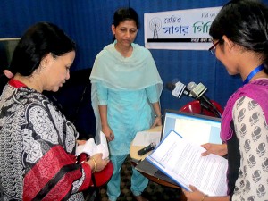 Visitor and volunteers at the Radio Sagor Giri Studio