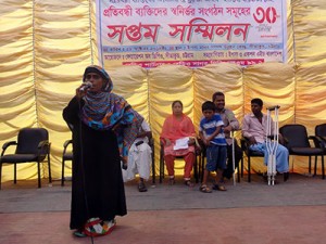 A women with disability performing on the stage 