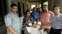 A woman receiving relief support at South Mithachari in Ramu