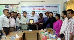 YPSA handovers a crest to Dr. Hasanuzzaman Chowdhury
