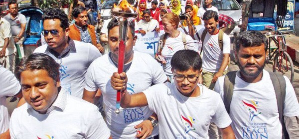 Runners carry the peace torch rally in Chittagong