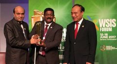 Vashkar Bhattacharjee of YPSA and Kabir Bin Anwar of a2i receiving trophy from ITU’s Secretary General Mr. Haolin Zhao.