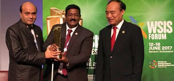 Vashkar Bhattacharjee of YPSA and Kabir Bin Anwar of a2i receiving trophy from ITU’s Secretary General Mr. Haolin Zhao.