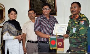 Palash Chowdhury, Director (Finance), YPSA is receiving the life membership certificate of Patients Welfare Society, Chittagong from the Director of CMCH
