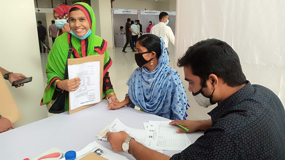 Participants in front of a booth