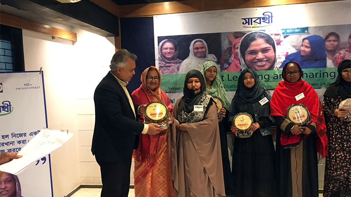 Chief Executive of YPSA Md. Arifur Rahman hand over the award plaque to women entrepreneurs