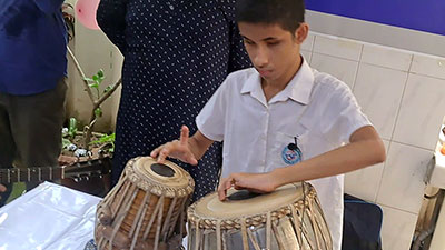 A PWD playing musical instrument.