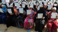 Women participants are showing their certificates 2