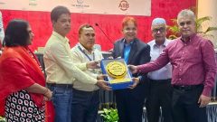 Md. Arifur Rahman is receiving the honor plaques on behalf of the winning teams from PKSF..