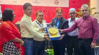 Md. Arifur Rahman is receiving the honor plaques on behalf of the winning teams from PKSF..