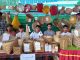 Youth with their products in a stall