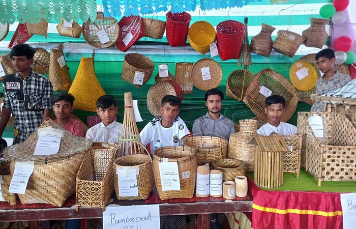 Youth with their products in a stall