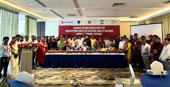 Group photo in front of banner