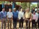 Group photo of WFP) delegation and YPSA officials in front of the Outlet.