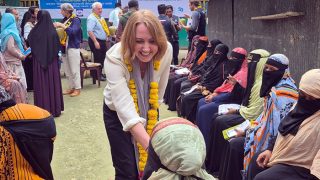 Australian High Commissioner Ms Susan Ryle interacting with woman.