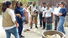 Visit a village home. Visitors are in the premises of beneficiary.