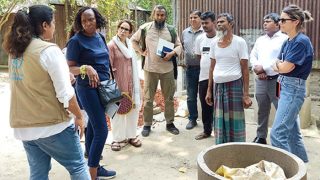 Visit a village home. Visitors are in the premises of beneficiary.