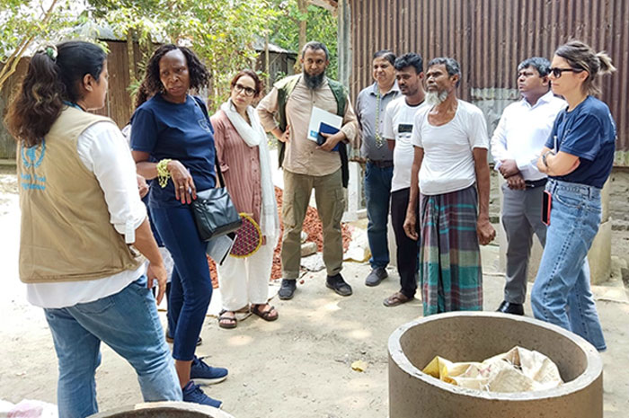 Visit a village home. Visitors are in the premises of beneficiary.
