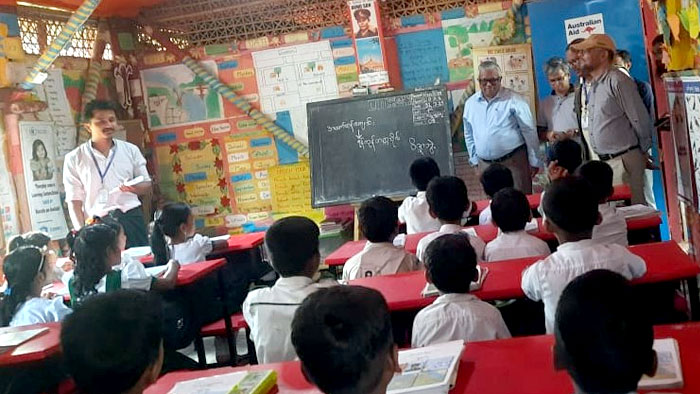 Visitors inside the learning center with the children
