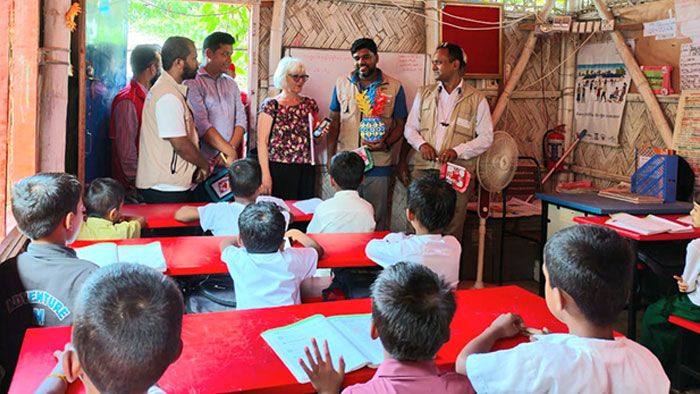 Visitors interacting with students 