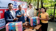 Indigenous adult girl receiving sewing machine
