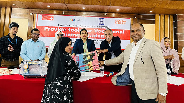 Women receiving sewing machine