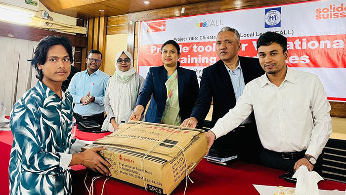 Youth receiving farming supplies