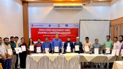 Group photo. People with holding booklet