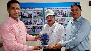 Receiving commemorative crest