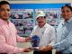 Receiving commemorative crest