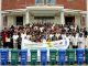 Group photo of students with phatic bin and banner