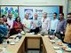 Presenting book to the Norwegian Refugee Council Country Director Mr. Dipankar Datta
